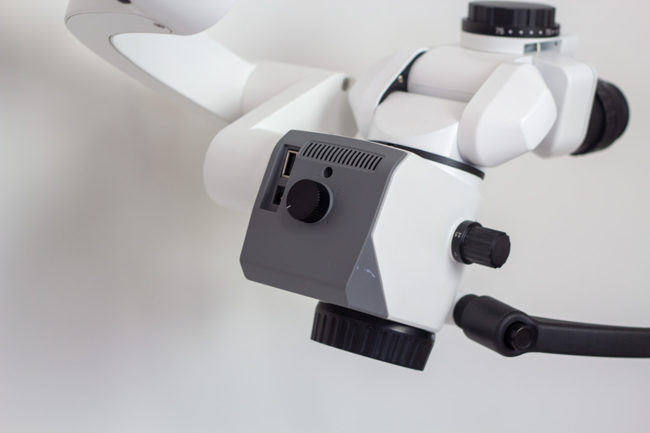 Close view of a surgical microscope body and binocular optics